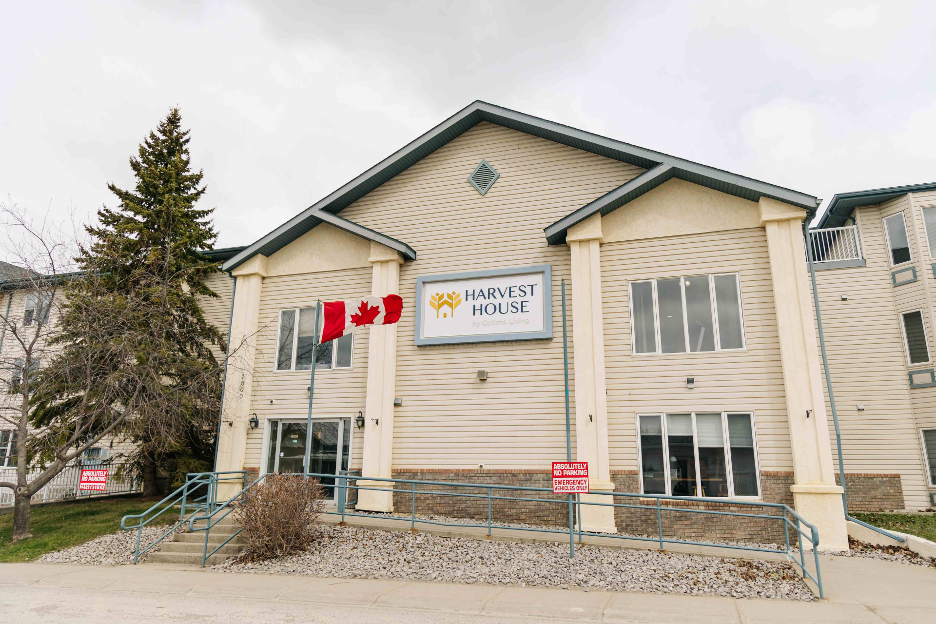 Front entrance of Harvest House senior living community in Olds, Alberta