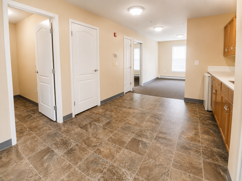 Kitchen and living area inside an independent living suite at Harvest House, Olds Alberta